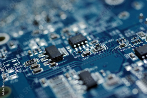 Obraz na płótnie Circuit computer board chip. Computer hardware technology. Circuit computer board. Close up blue color. w salonie