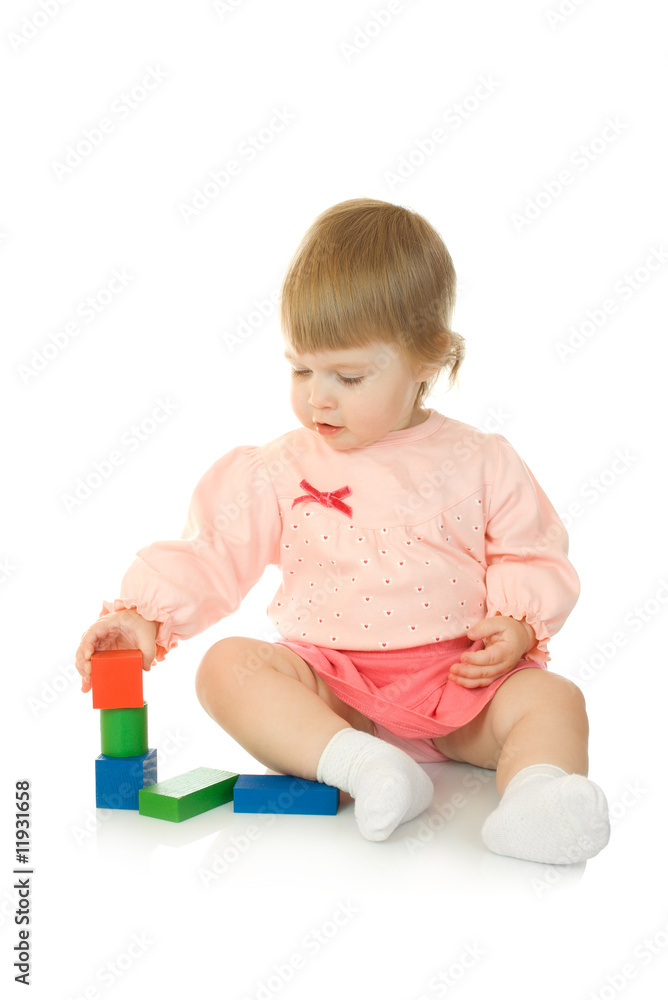Small baby with a toy pyramid isolated
