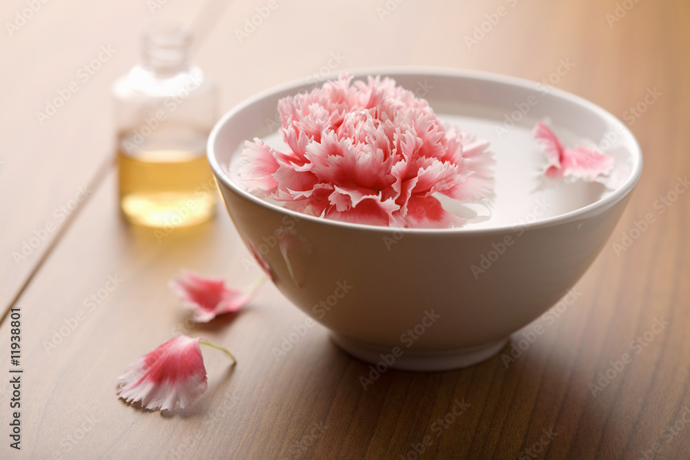 flower and essential oils in bottle. spa and body care backgroun flower and essential oils in bottle. spa and body care backgroun