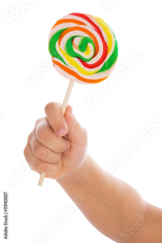 Color lollipop in child hand