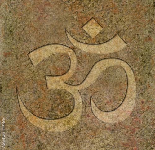 Om symbol engraved on stone photo