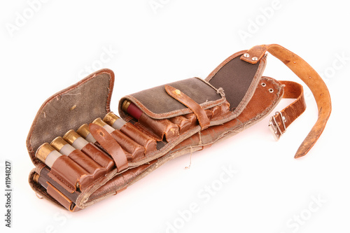 Old leather bandolier on a white background photo