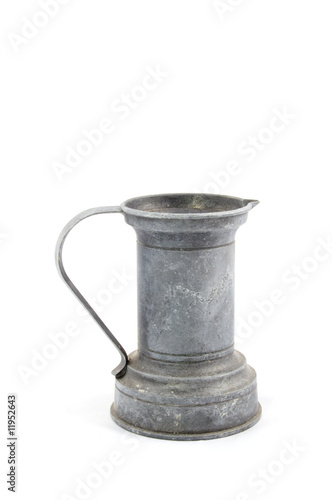 view of antique tin pitcher photo