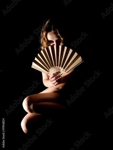 girl with a fan on black