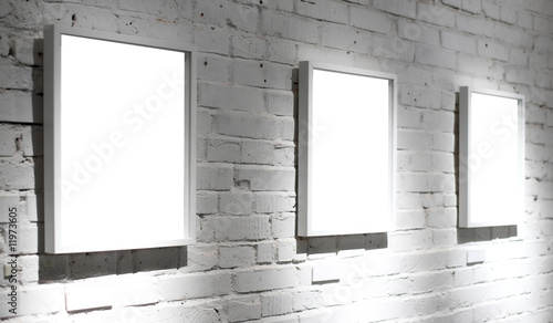 Three frames on white wall