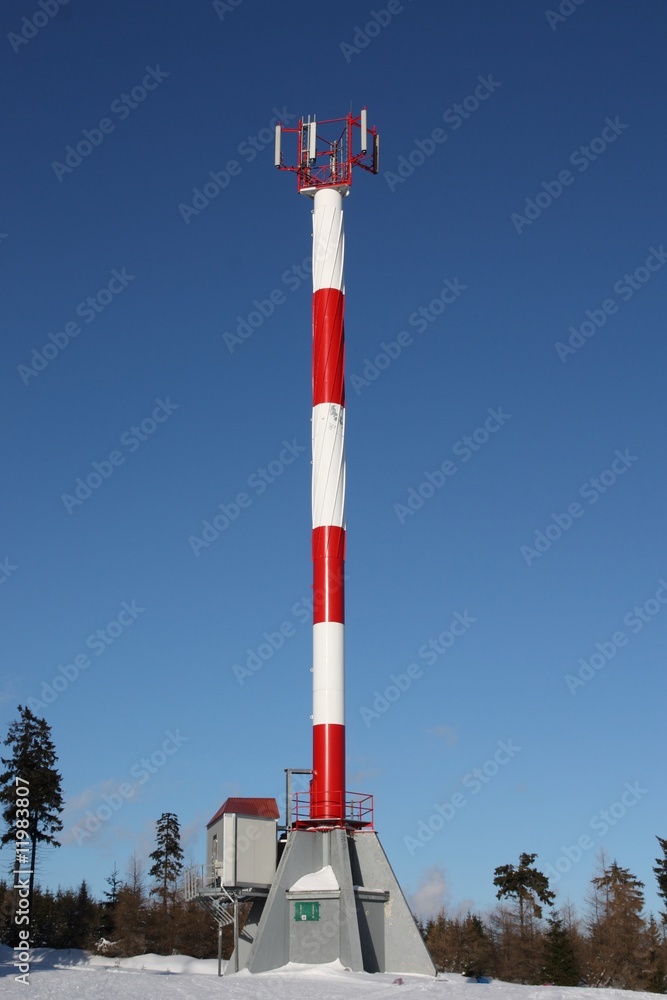 gsm antenna (telecomunications tower ) on blue sky
