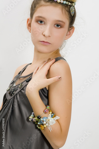 Fashion girl showing jewels and bracelet