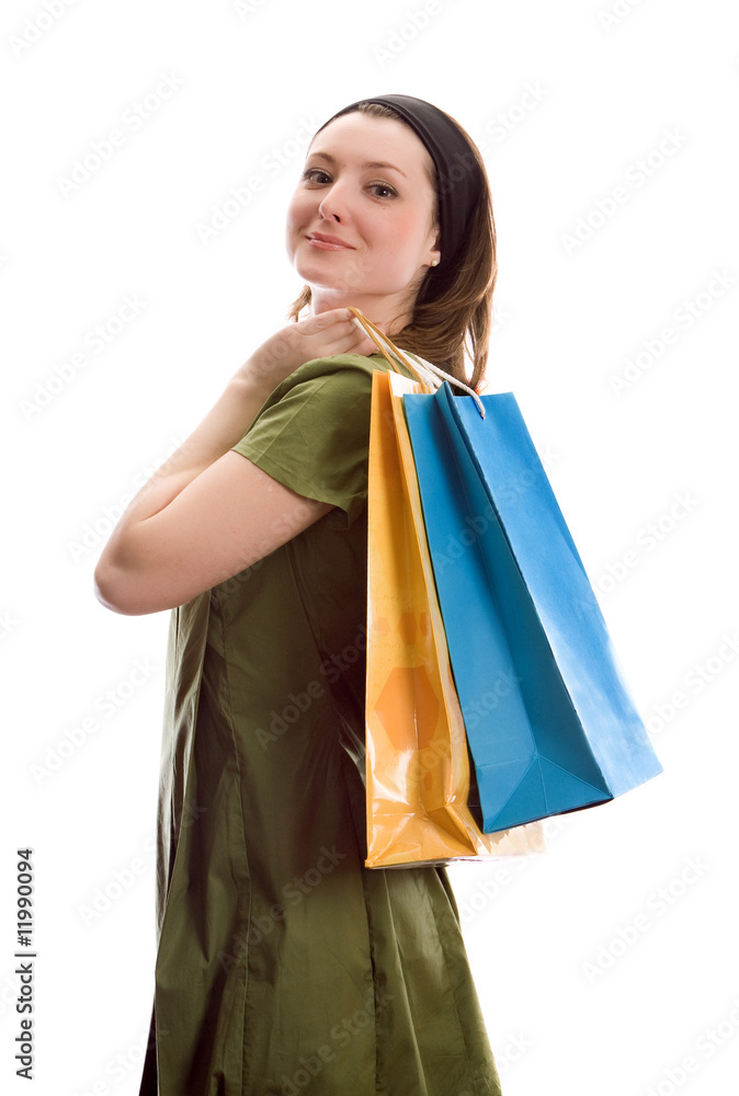 Beautiful girl with shopping bags. Isolated on white