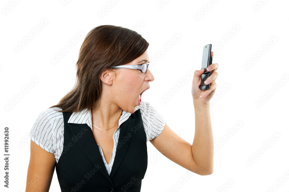 Angry businesswoman shouting to mobile Angry businesswoman shouting to mobile
