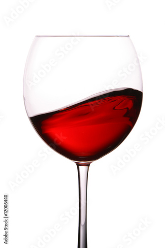 Glass of red wine with wave
