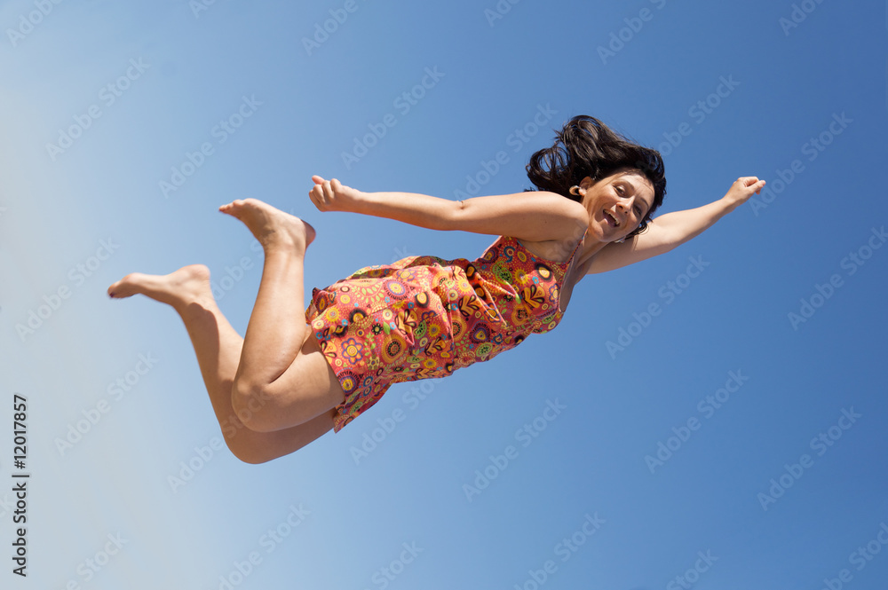 Fototapeta premium Beautiful girl flying