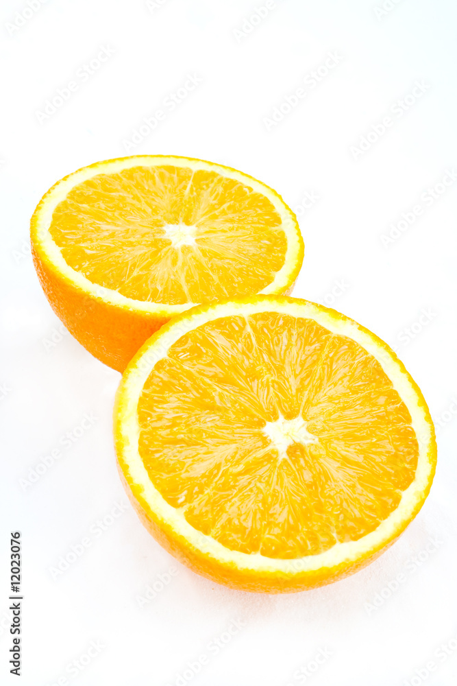 A pair of halved orange sections on white A pair of halved orange sections on white