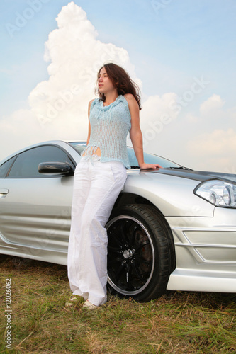 Woman stands having leant on a sport car © Pavel Losevsky