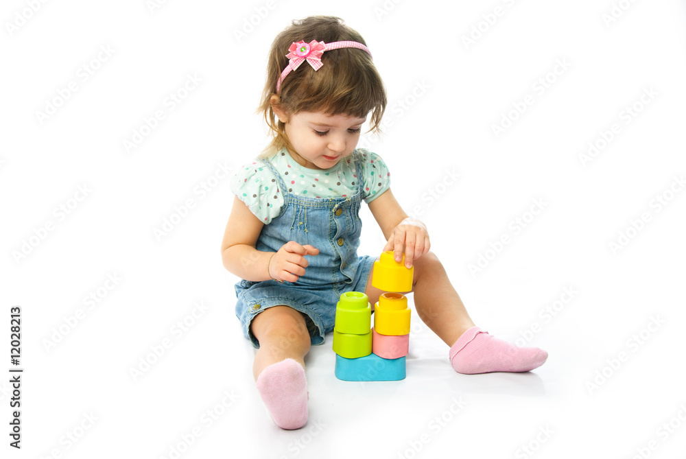 cute one year old girl making a pyramid cute one year old girl making a pyramid