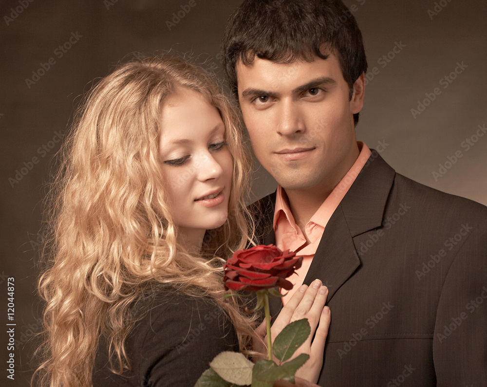 Beatiful couple on black background with rose Beatiful couple on black background with rose