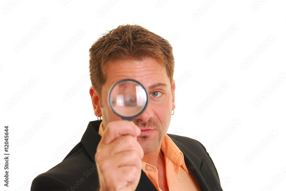 Business man holding a magnifying glass Business man holding a magnifying glass