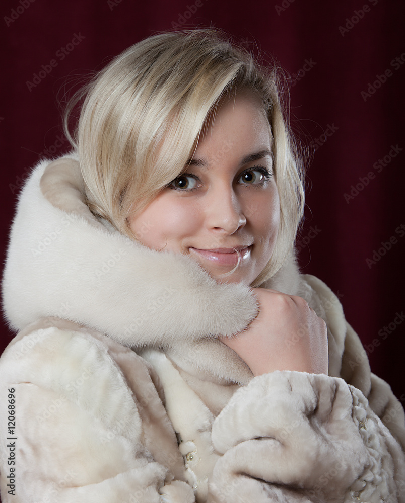 Portrait of the young beautiful girl in a fur coat Portrait of the young beautiful girl in a fur coat