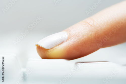 Female finger typing.