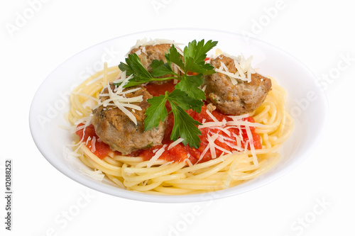 spaghetti with meatballs in tomato sauce on white plate