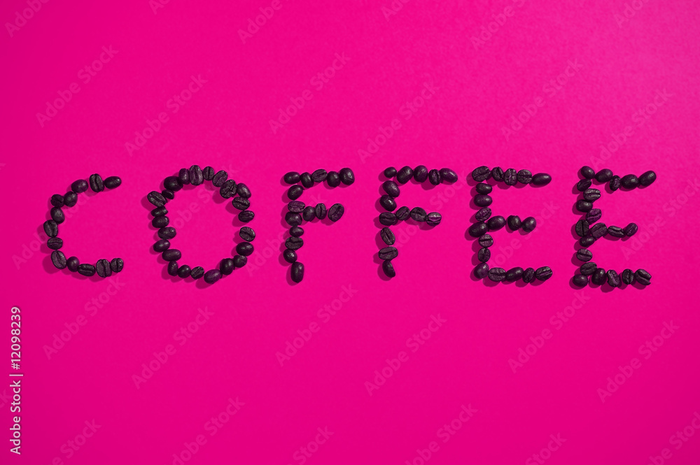 coffee written with beans on pink coffee written with beans on pink