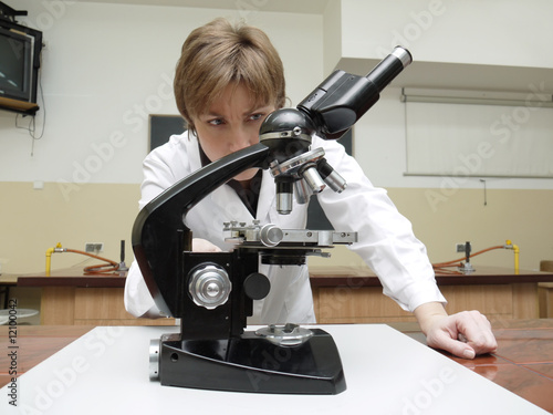 Chemistry teacher with microscope photo