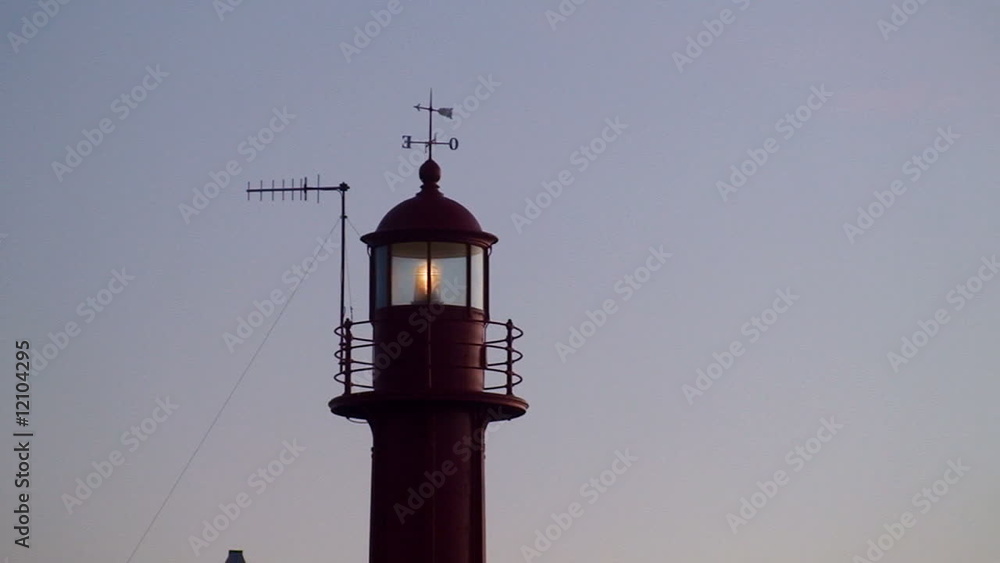 Lighthouse lighted at beautiful sunset Lighthouse lighted at beautiful sunset