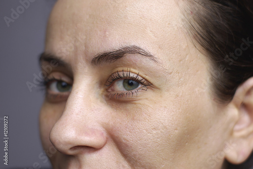 Fototapeta Naklejka Na Ścianę i Meble -  close up beautiful green eyes of woman with on left eye