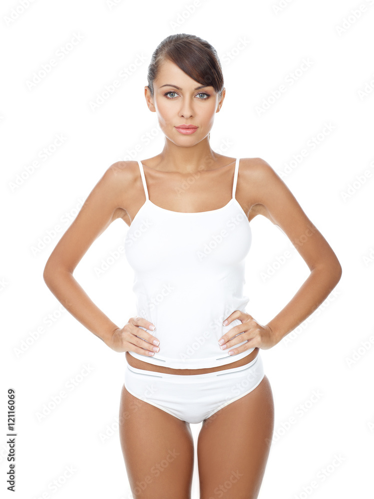 Young beautiful woman in white fitness clothing Young beautiful woman in white fitness clothing