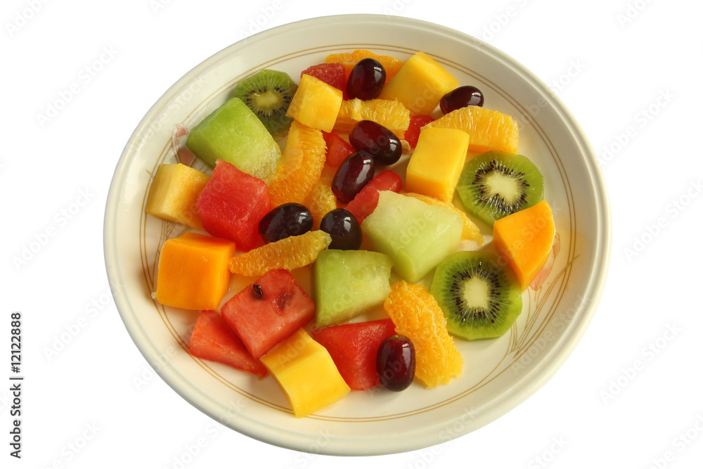 Healthy mixed fruit salad on a plate isolated over white.