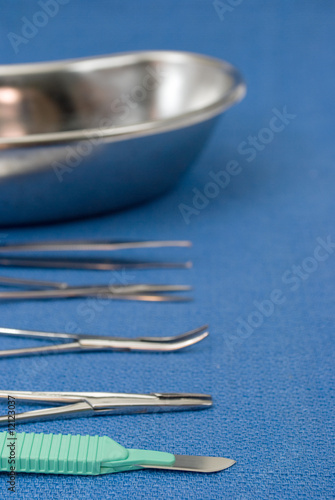 Surgical instruments on blue steril field