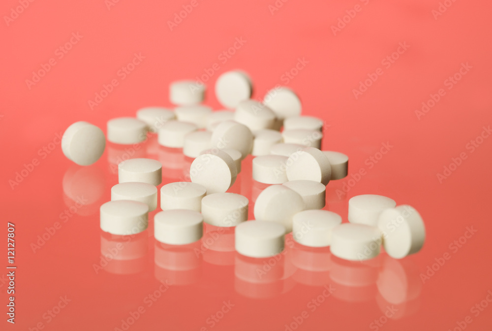 Pills towards red background Pills towards red background
