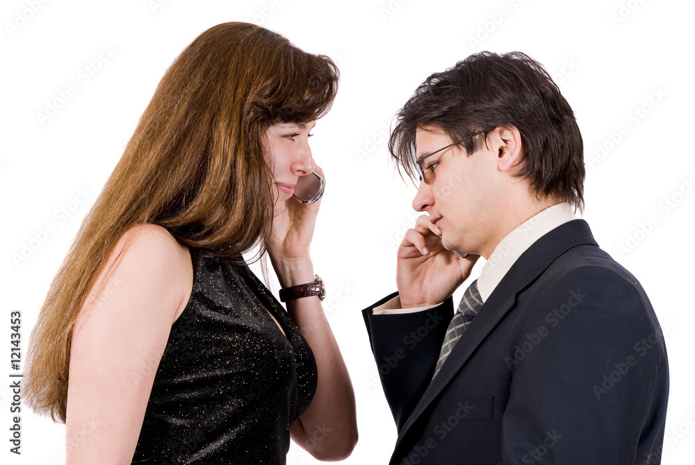 Young couple talking on the phone isolated on white Young couple talking on the phone isolated on white