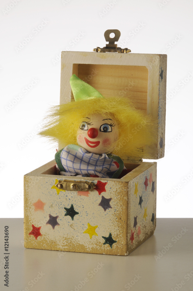 Foto Stock Scatola con clown a molla | Adobe Stock