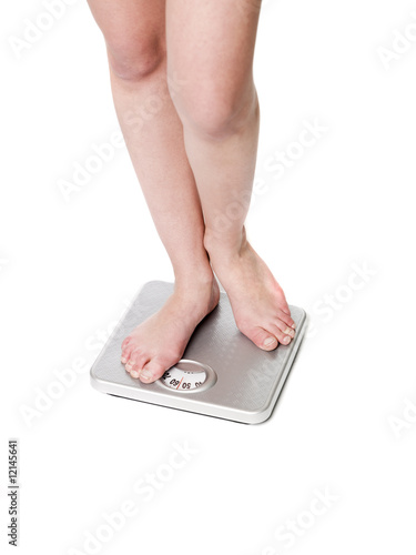 Standing on a weightscale photo