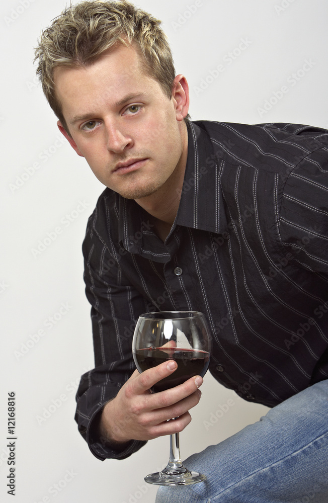 Man holding glass of wine Man holding glass of wine