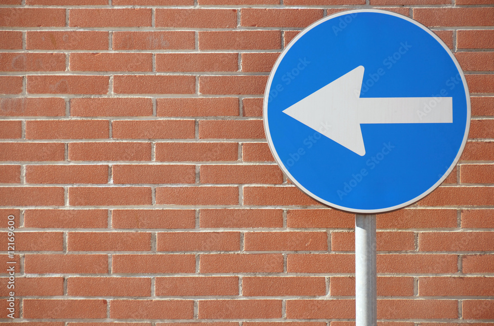 One way heading to left on wall background One way heading to left on wall background