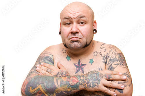 portrait of a bald man with tattoos