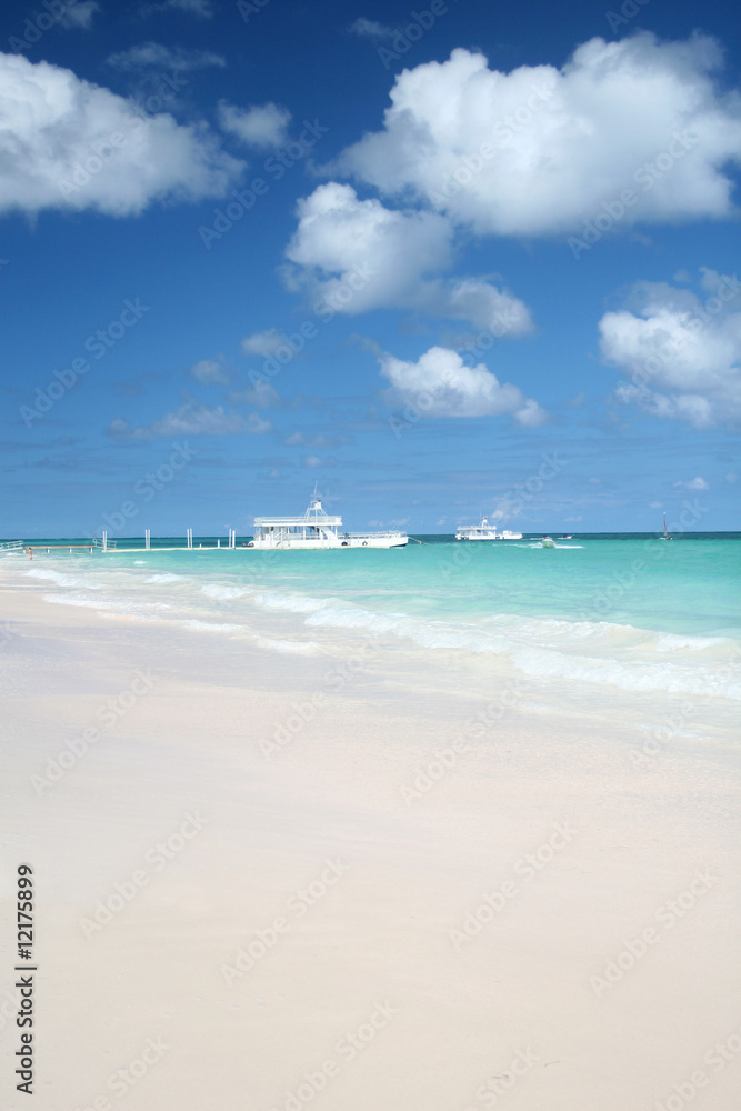 Pier and Ferry Boat in a Tropical Ocean, White Sand Beach