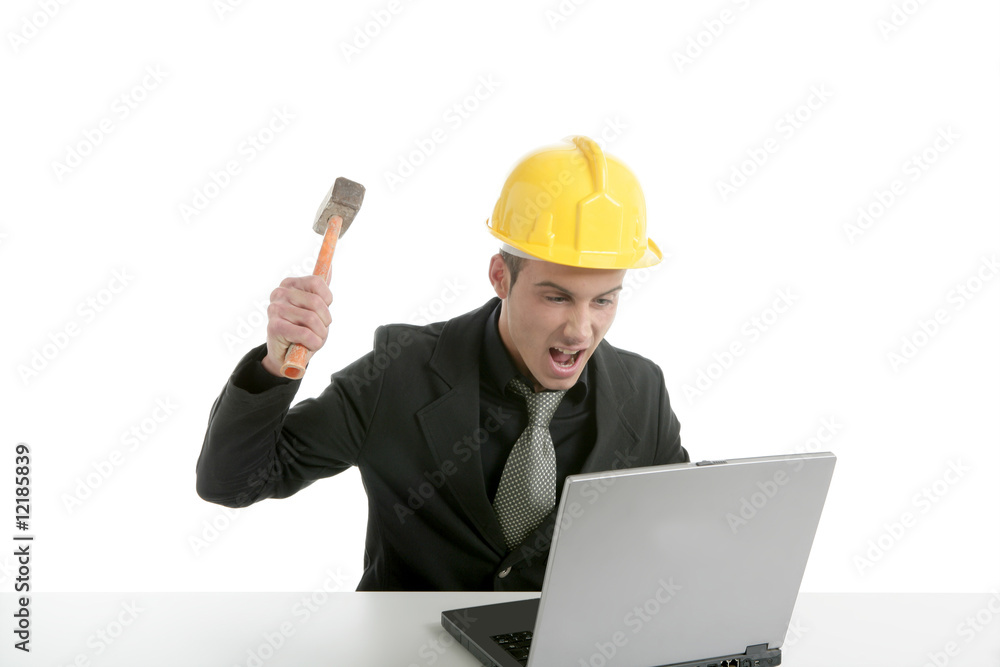 Amgry businessman and hammer with computer