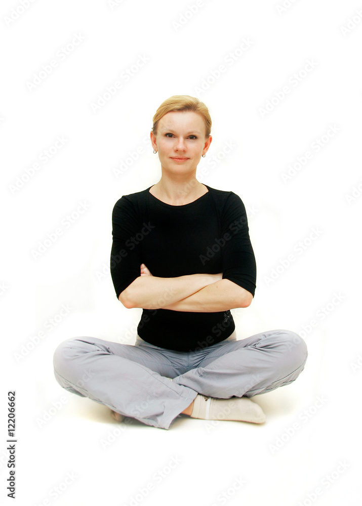 young woman sitting with her arms crossed young woman sitting with her arms crossed