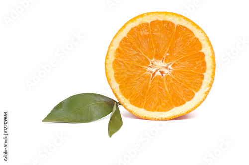 Juicy,ripe orange and green leaves on a white background.