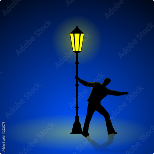 betrunkener an einer strassenlaterne
