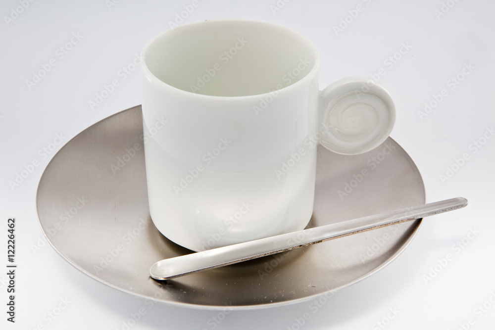 White coffe cup with metal saucer on white. White coffe cup with metal saucer on white.