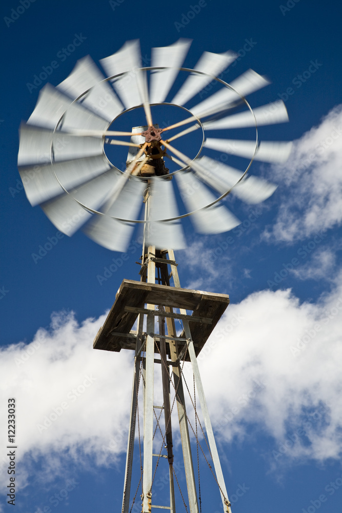 Old west-style farm windmill for pumping water Old west-style farm windmill for pumping water