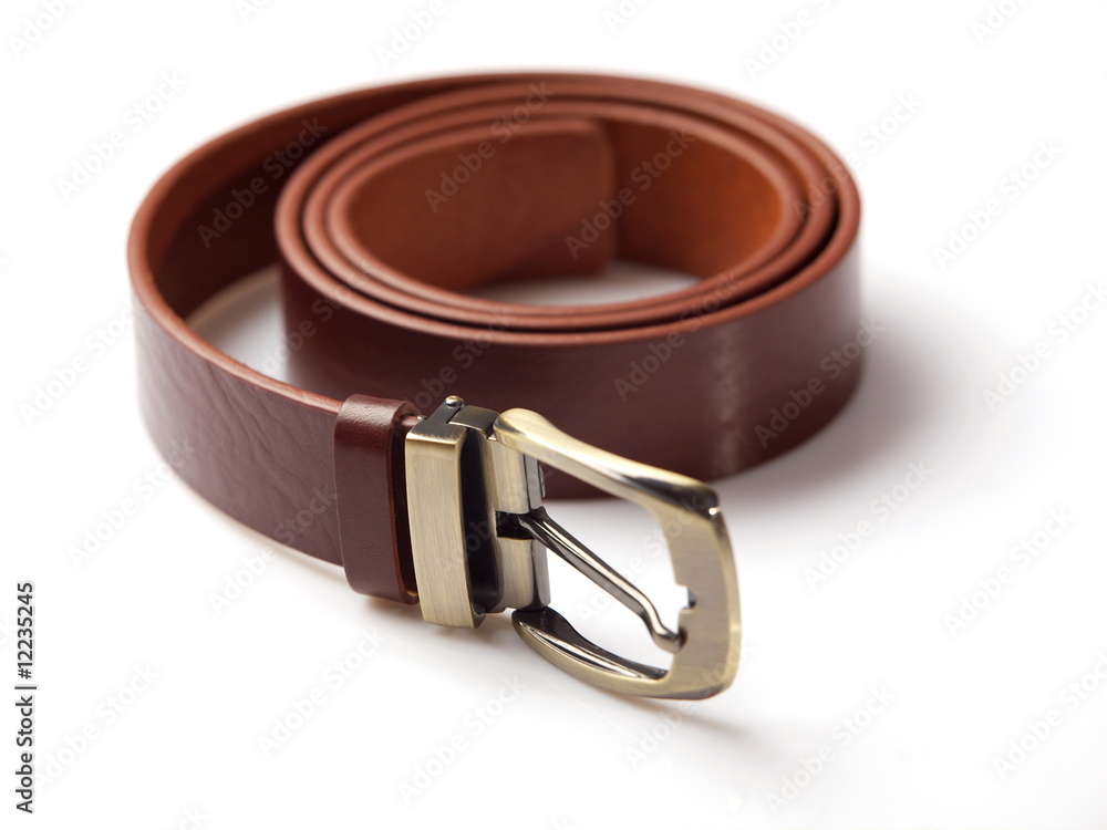 Brown men's belt with bronze clasp on white background Brown men's belt with bronze clasp on white background