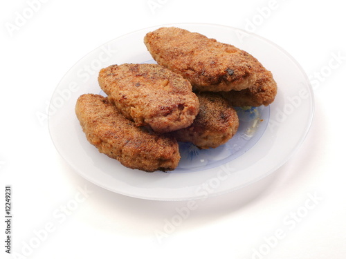 Fried meatballs on the plate on white background