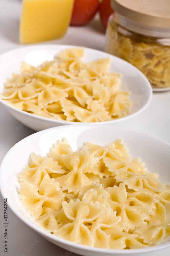 Two servings of cooked plain fresh farfalle pasta Two servings of cooked plain fresh farfalle pasta