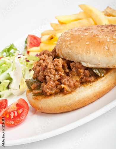 minced meat burger with salad and fries