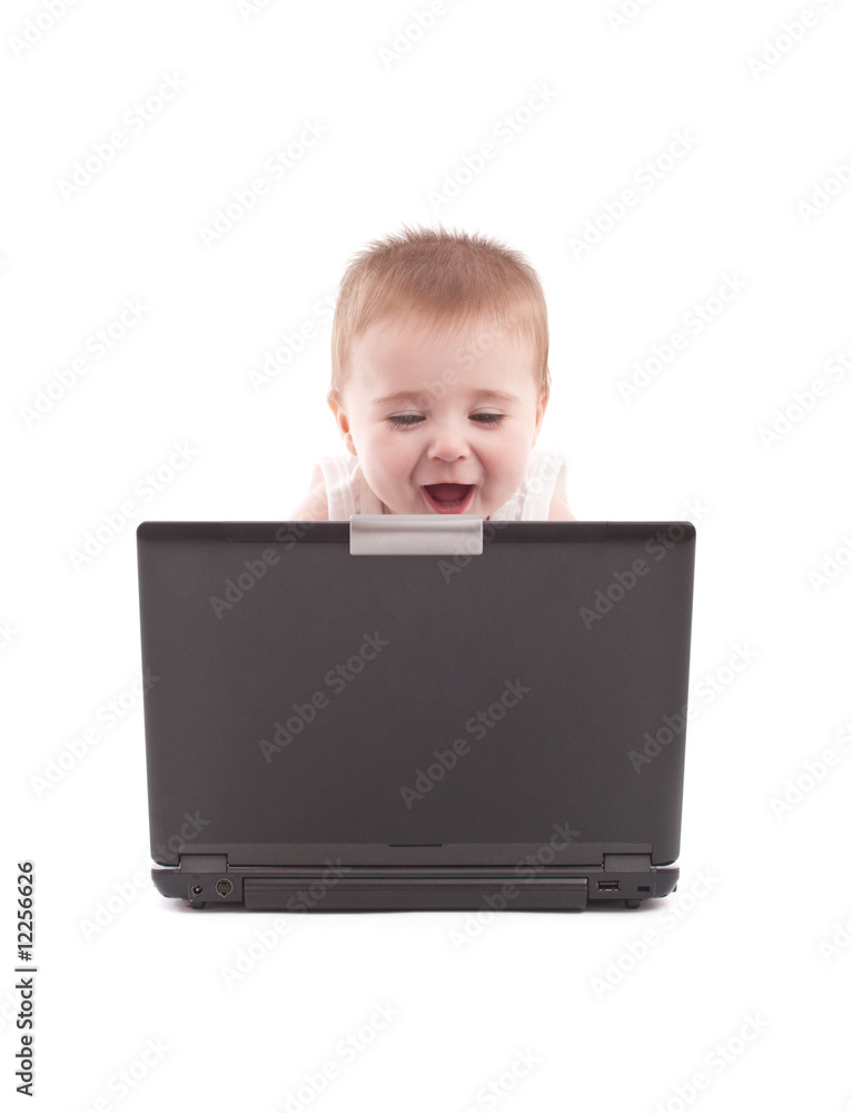Happy baby boy looking at laptop Happy baby boy looking at laptop