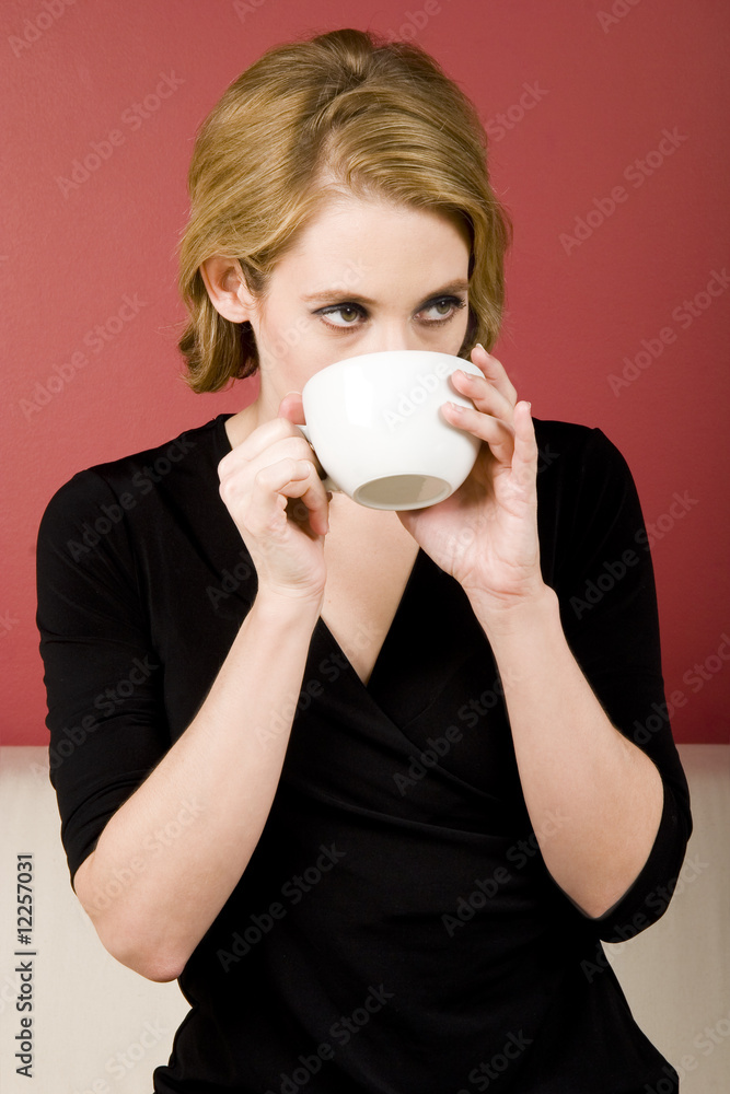 Woman drinking tea / coffee, hot beverage from cup Woman drinking tea / coffee, hot beverage from cup
